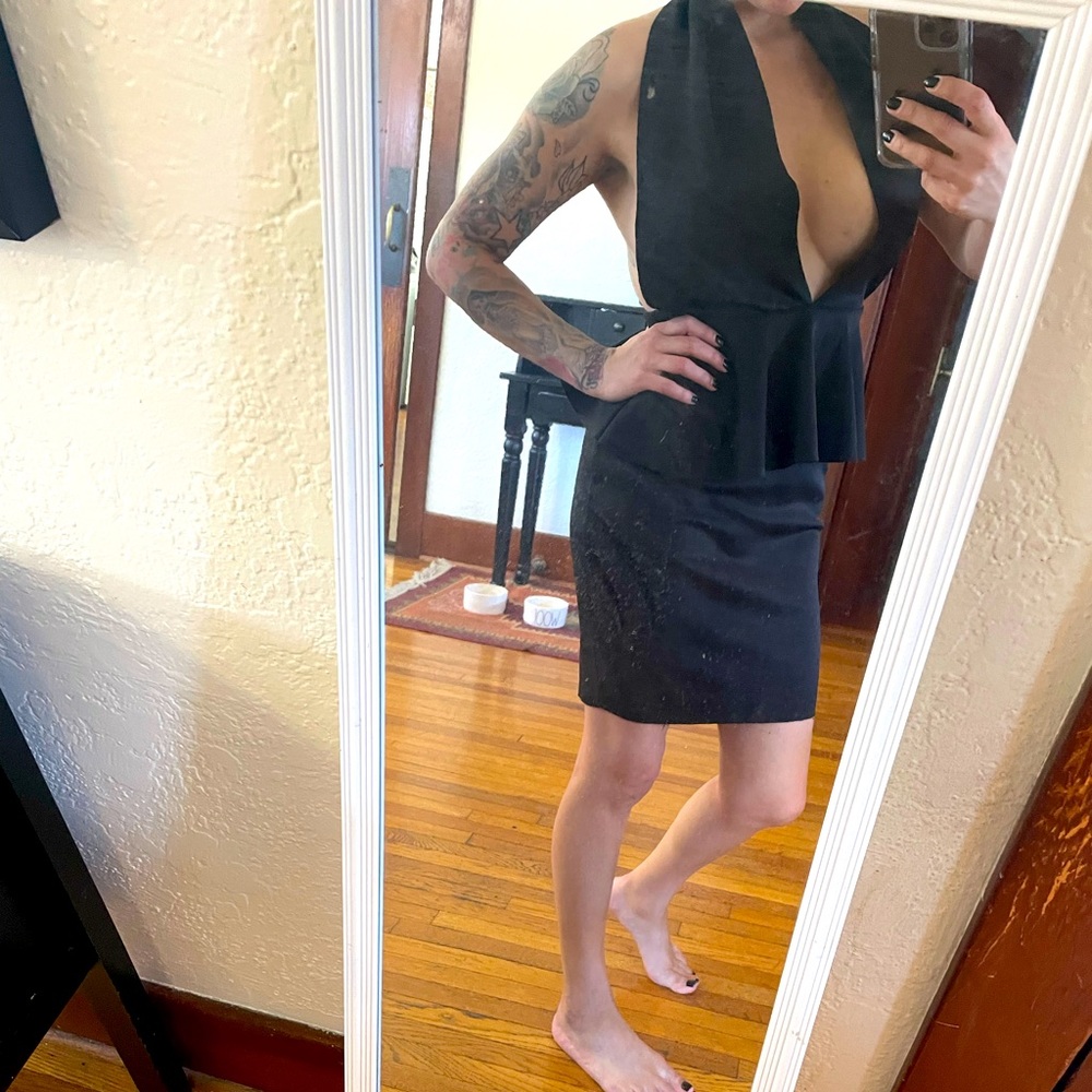 Symphony dress. Low cut in the front. Open back.
